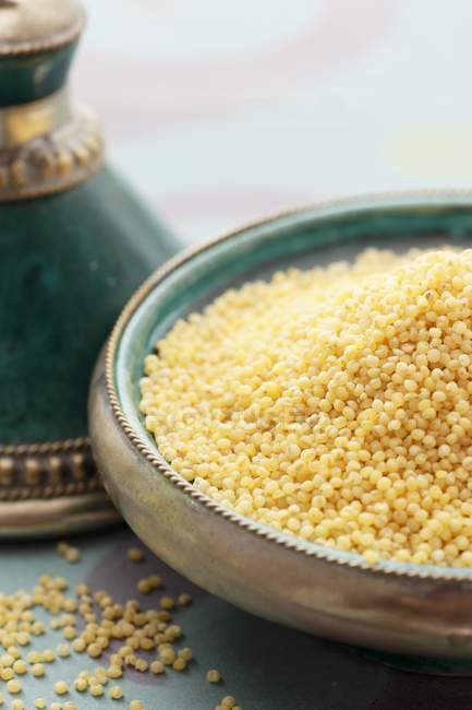 Millet grains in Oriental dish — Stock Photo