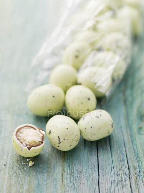 Closeup view of marzipan Easter eggs in cellophane bag — Stock Photo