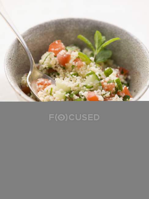 Couscous salad with tomatoes — Stock Photo