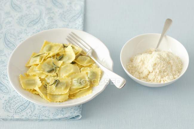 Cheese ravioli with butter and sage — Stock Photo