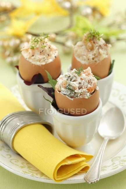 Assorted filled eggshells — Stock Photo