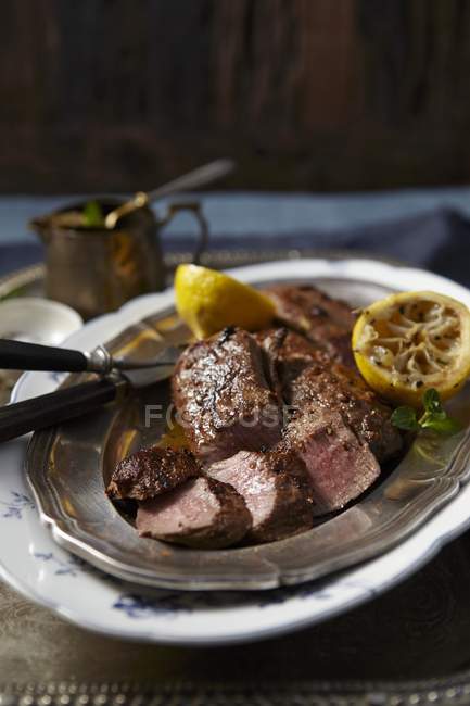 Roasted Lamb with lemons and mint sauce — Stock Photo