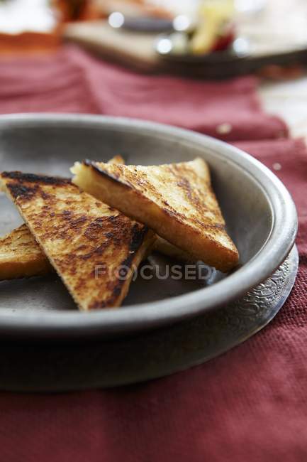 Triangles of fried bread — Stock Photo
