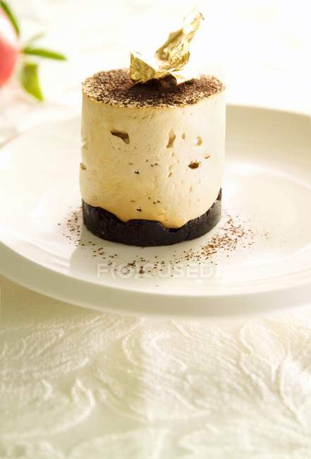 Quark mousse with chocolate and gold leaf — Stock Photo