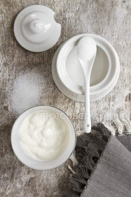Pot of sugar over table — Stock Photo