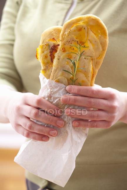 Woman holding pizzas — Stock Photo