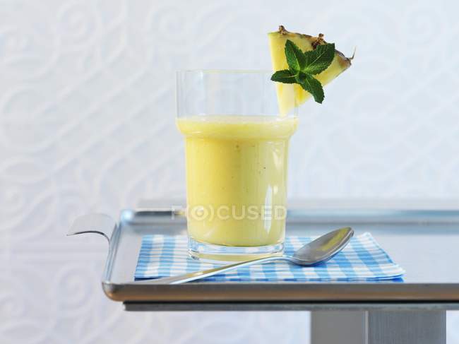 Glass of pineapple smoothie — Stock Photo