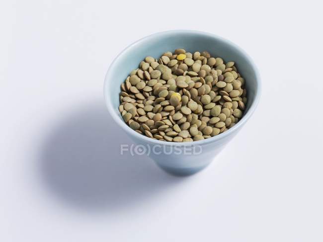 Closeup view of brown lentils in a dish — Stock Photo