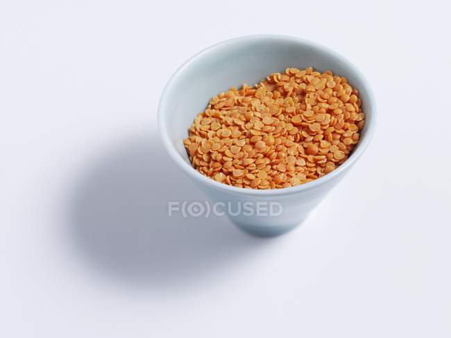 Closeup view of red lentils in a bowl — Stock Photo