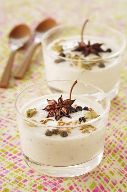 Panna cotta with spices in glasses — Stock Photo