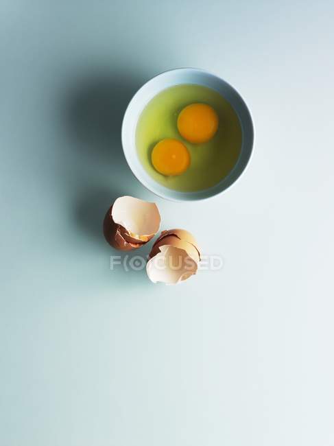 Raw eggs in measuring jug — Stock Photo