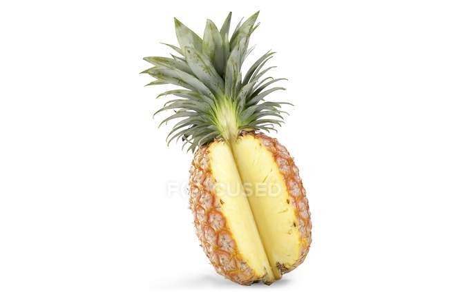 Pineapple with a wedge — Stock Photo