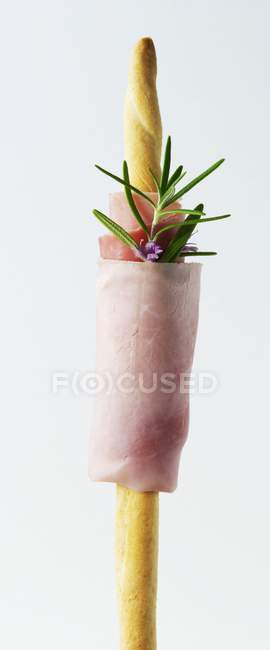 Grissini with ham and rosemary — Stock Photo