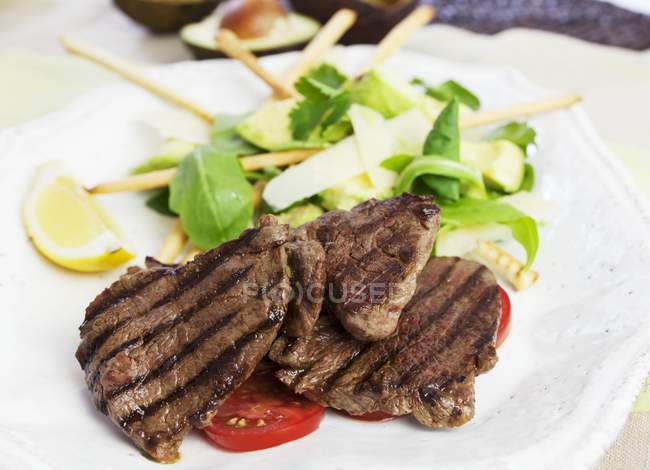 Barbecued beef steaks — Stock Photo