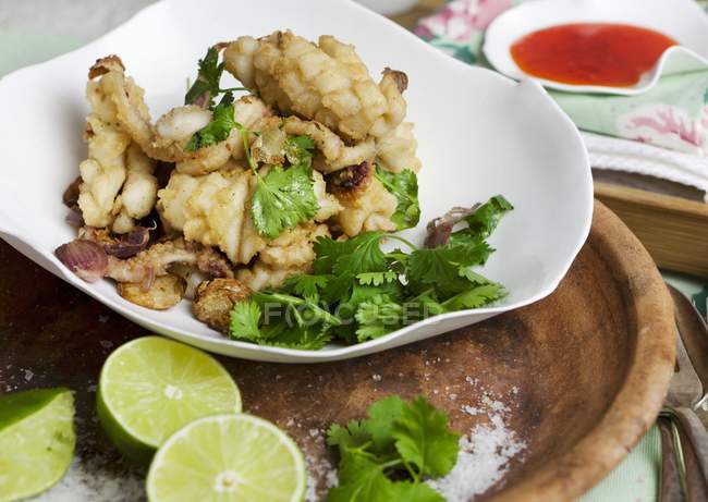 Squid with coriander and limes — Stock Photo