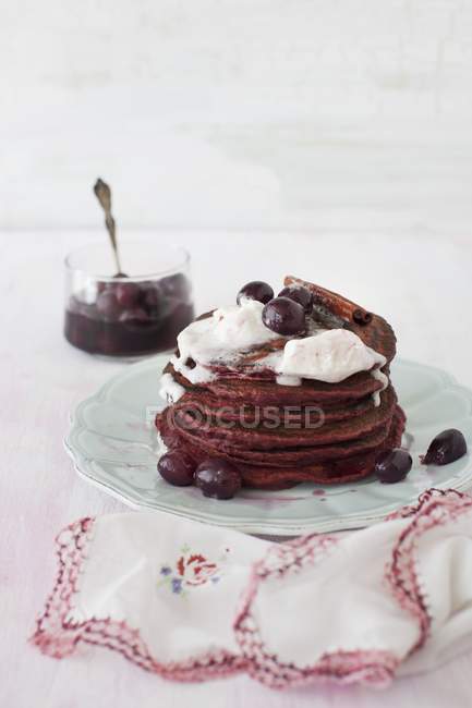 Pancakes with sweet grape sauce — Stock Photo