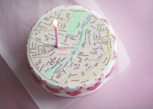 Wedding cake topped with city map — Stock Photo