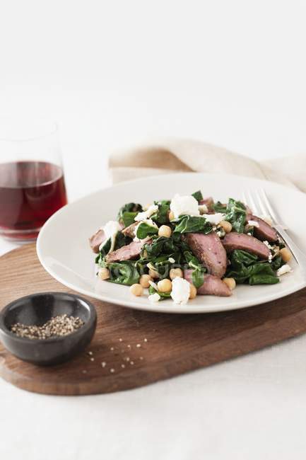 Lamb salad with spinach — Stock Photo