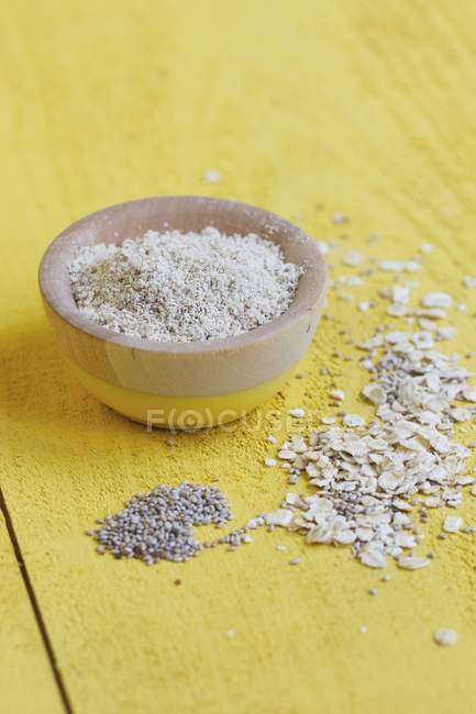 Rolled Oats in wooden bowl — Stock Photo