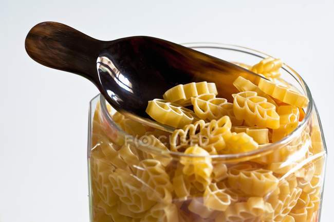 Dried pasta in storage jar — Stock Photo