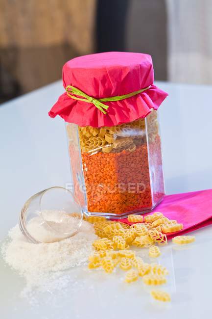 Dried uncooked pasta and red lentils — Stock Photo