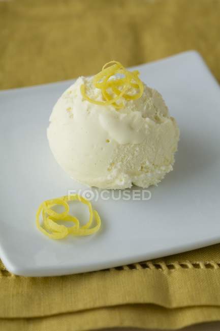Scoop of lemon ice cream — Stock Photo