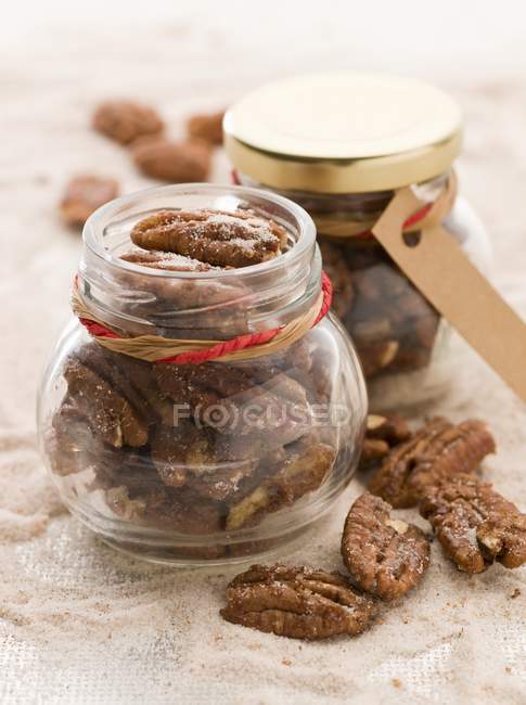 Spicy pecan nuts in jar — Stock Photo