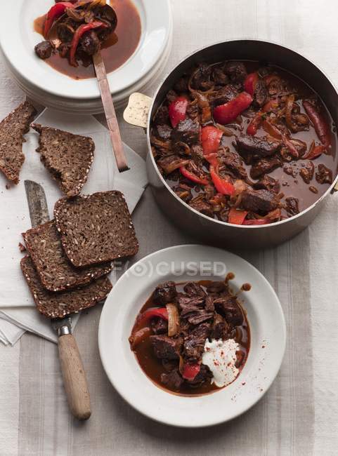 Beef goulash with sour cream — Stock Photo