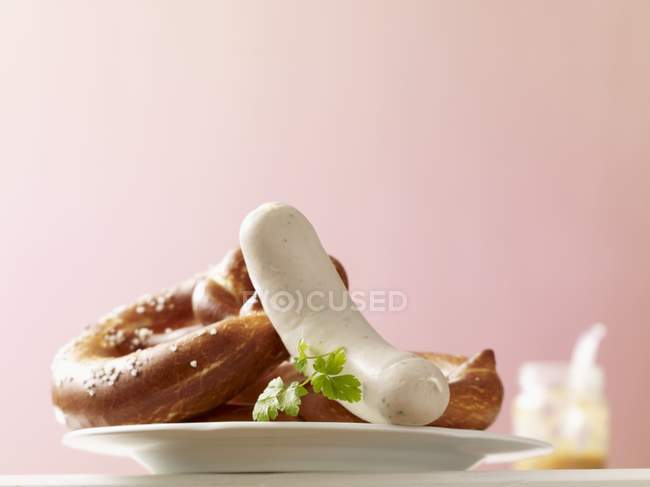 Pretzels and white sausages — Stock Photo