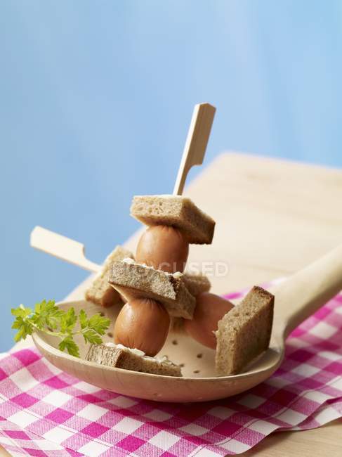 Skewers of mini sausages — Stock Photo