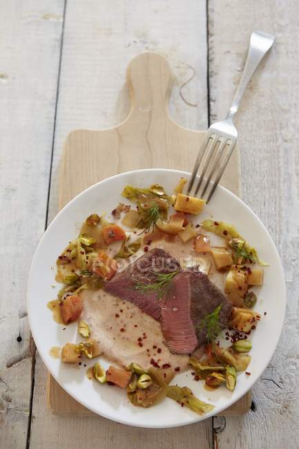 Saddle of lamb with vegetables — Stock Photo
