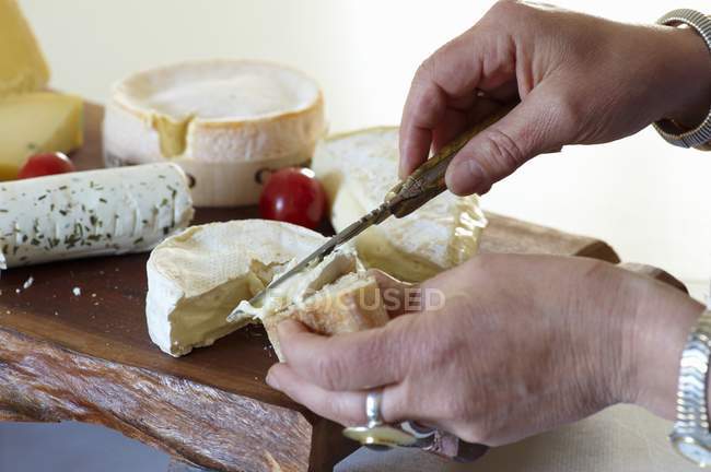 Slices of baguette being spread — Stock Photo