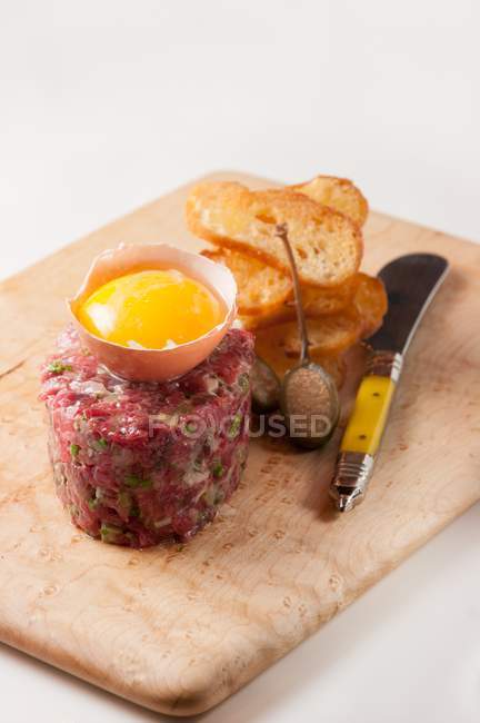 Steak tartare with egg — Stock Photo