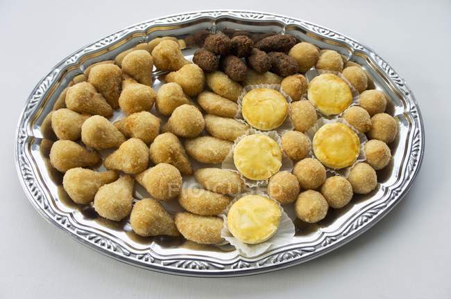 Top view of Salgadinhos savoury filled pastries on a tray — Stock Photo