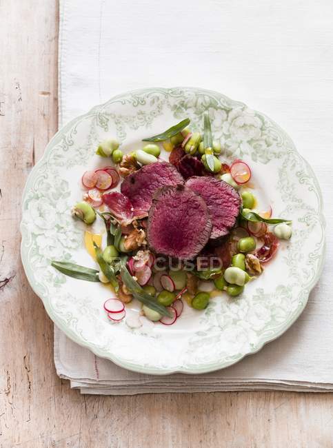 Venison laying on plate — Stock Photo