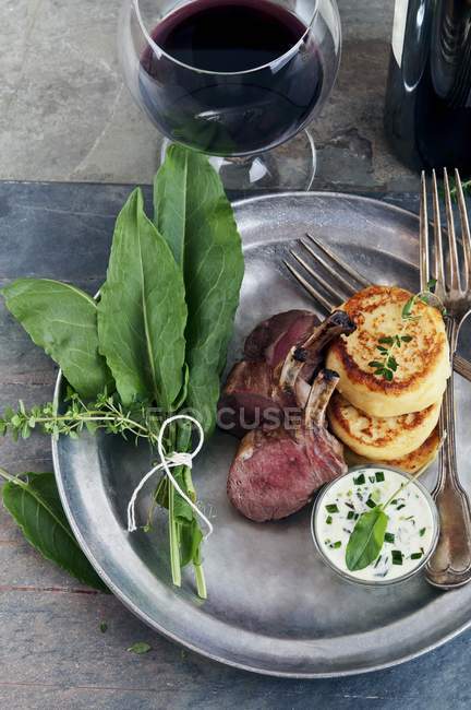 Lamb chops with potato pancakes — Stock Photo