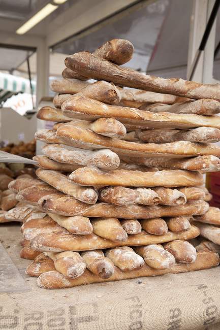 Stacked freshly baked baguettes — Stock Photo