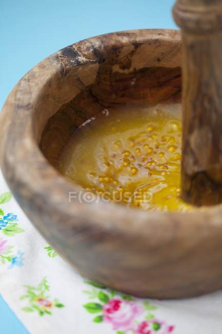 Honey and mustard in mortar — Stock Photo