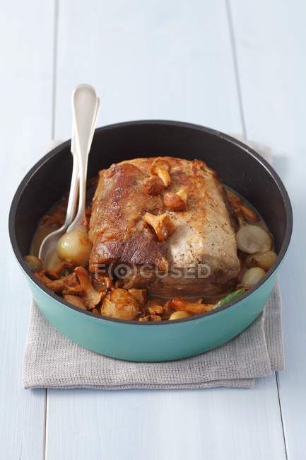 Pork loin braised with shallots and chanterelles — Stock Photo