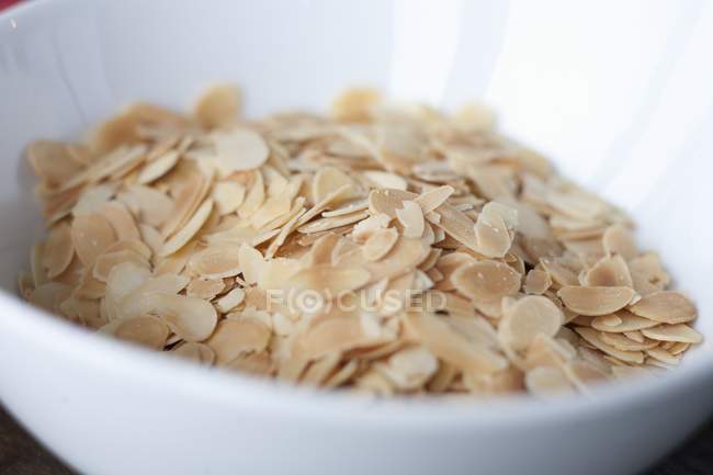 Slivered almonds in bowl — Stock Photo