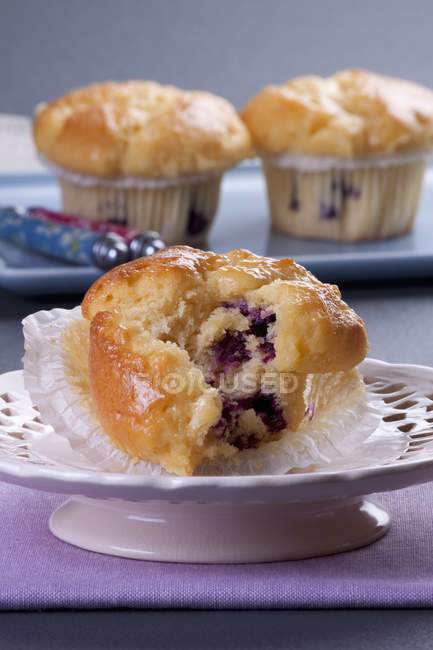 Blueberry muffins on plates — Stock Photo
