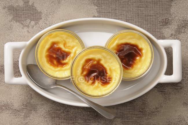 Closeup top view of Creme caramel in three glass dishes — Stock Photo