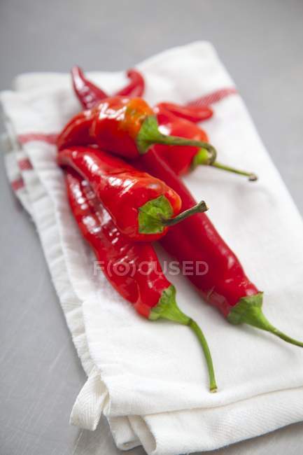 Red chillies on napkin — Stock Photo