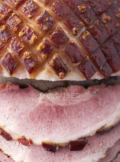 Partly sliced Roasted crackling pork — Stock Photo
