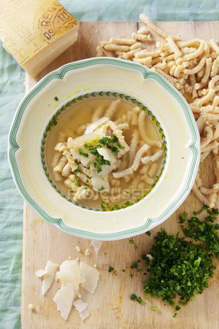 Passatelli pasta soup — Stock Photo