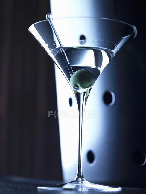 Martini in glass with olive — Stock Photo