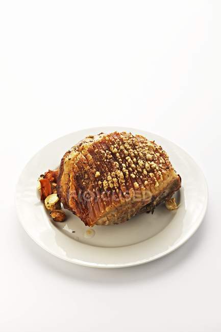 Whole roasted shoulder of pork — Stock Photo