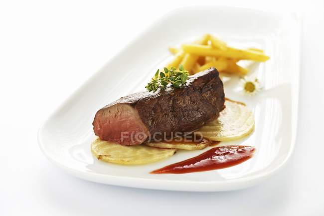 Saddle of venison with fried sugar beet — Stock Photo