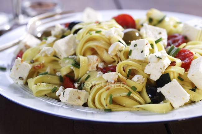 Tagliatelle pasta with feta — Stock Photo