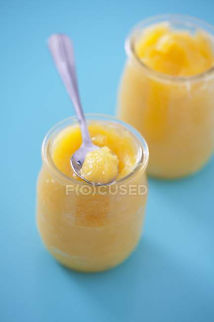 Closeup view of lemon curd in two jars — Stock Photo